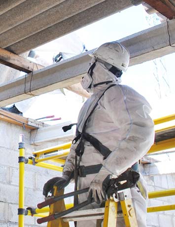 surveyor looking at a roof with asbestos