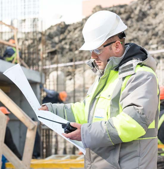 surveyor looking at an asbestos report
